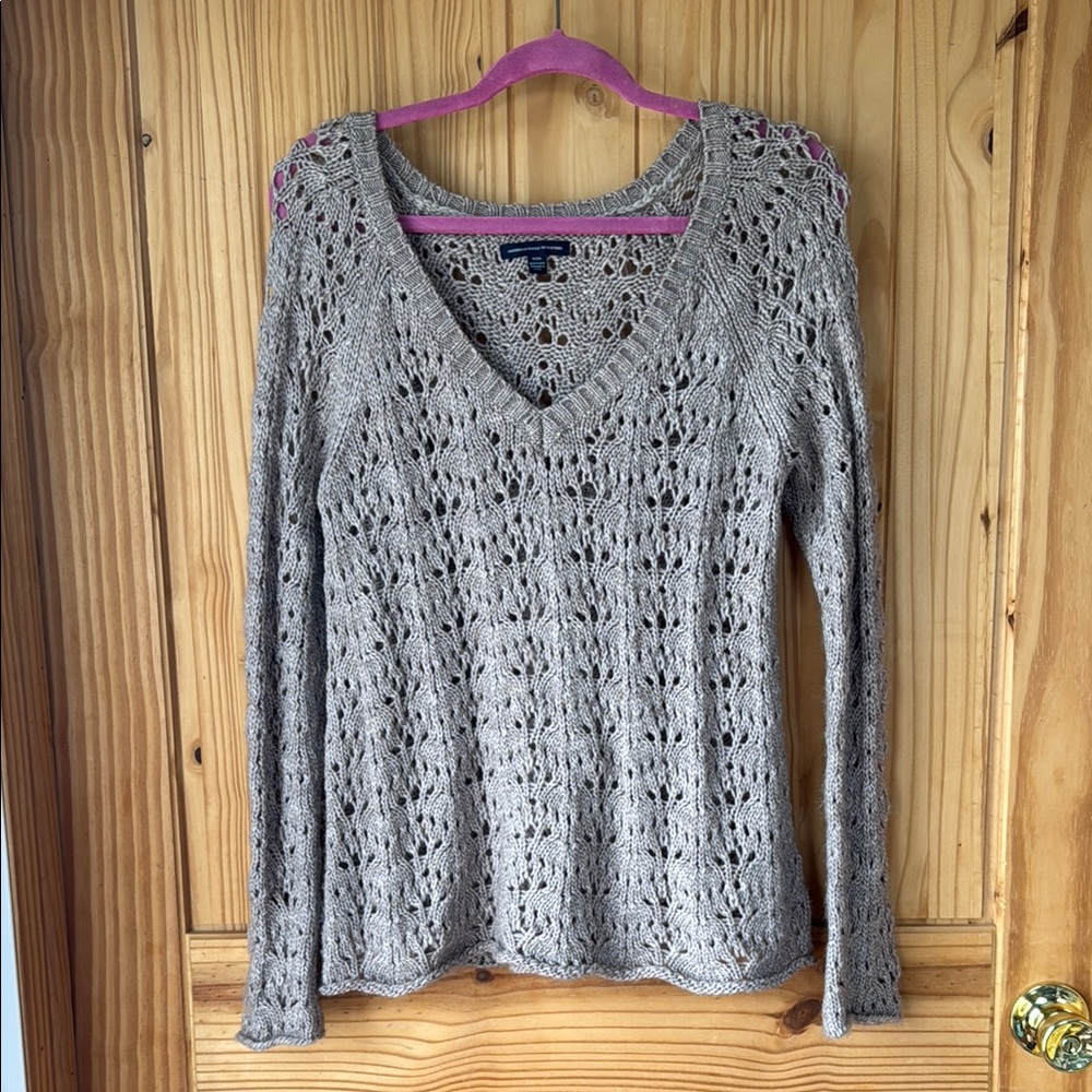 Tan V-Neck Sweater with Intricate Knit Pattern